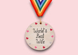 a wooden medal with a colorful ribbon around it