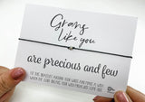 a person holding a card with a message on it