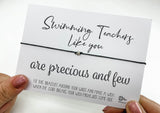 a person holding a card with a message on it