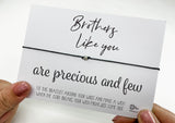 a person holding a card with a message on it