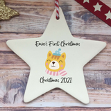 a white ceramic star ornament with a dog on it