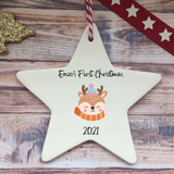 a white ceramic star ornament with a reindeer on it