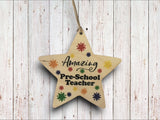 a wooden star ornament hanging on a wall
