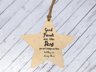 a wooden star ornament with a quote on it