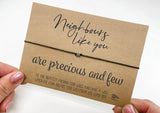 a hand holding a card that says, nobody's like you are precious and