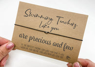 a person holding a card with a message on it