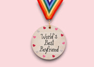 a wooden medal with a colorful ribbon around it