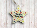 a wooden star ornament with the words super teacher on it
