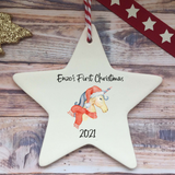 a white ceramic star ornament with a unicorn on it