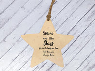 a wooden star ornament with a saying on it