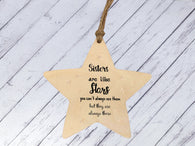 a wooden star ornament with a saying on it