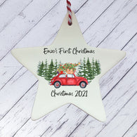 a ceramic star ornament with a red car and a christmas tree on it
