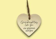a ceramic heart hanging on a string
