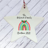 a ceramic star ornament with a rainbow on it