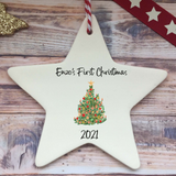 a ceramic star ornament with a christmas tree on it