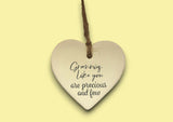 a ceramic heart hanging on a string