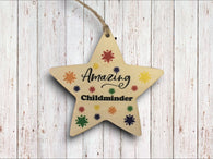 a wooden star ornament with an inscription on it