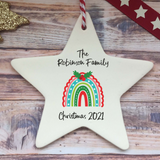 a personalized ceramic star ornament with a rainbow
