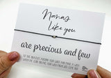 a person holding a card with a message on it