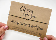 a person holding a card with a message on it