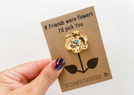 a person holding a card with a flower on it