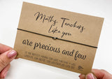 a hand holding a card that says, matty teachers like you are precious and