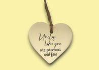a ceramic heart hanging on a string