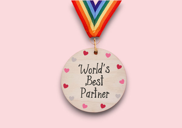 a wooden medal that says world's best partner