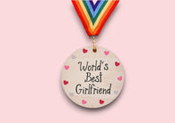 a wooden medal with the words world's best girlfriend on it