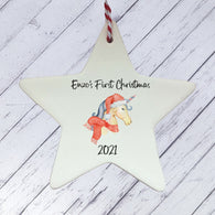 a ceramic star ornament with a unicorn on it
