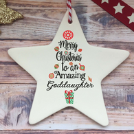 a white ceramic star ornament with merry christmas to an amazing goddaught