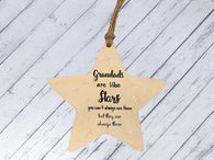 a wooden star ornament hanging on a string