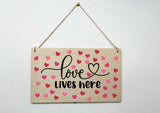 valentines day hanging plaque - love lives here